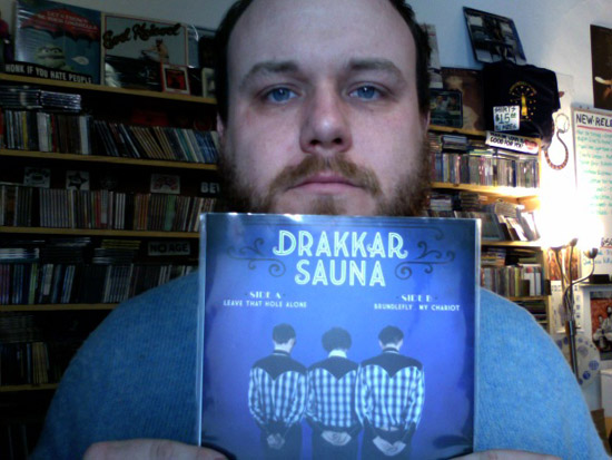 Mikey Kapinus (keyboardist from Magnolia Electric Co.) holds a Drakkar Saunna 7'