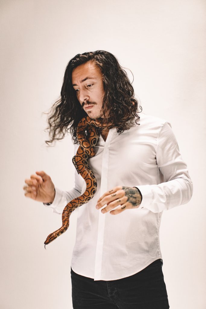 Noah Gundersen in White Room with Snake